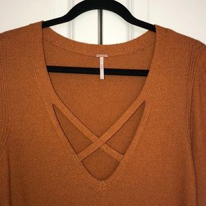 Free People rust knit tunic with side slits.